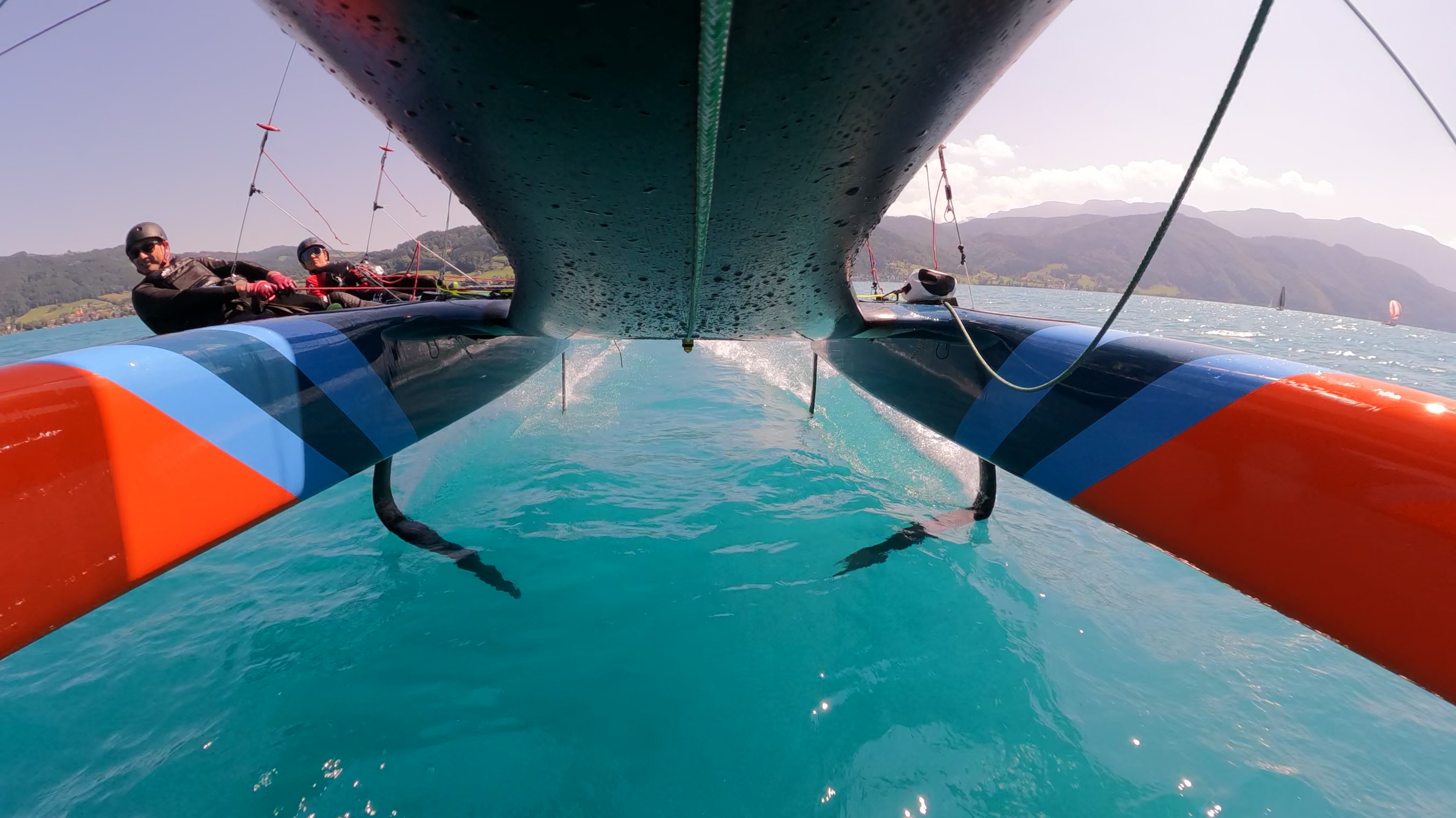 Flyte foiling on Lake Attersee with two sailors on trapeze